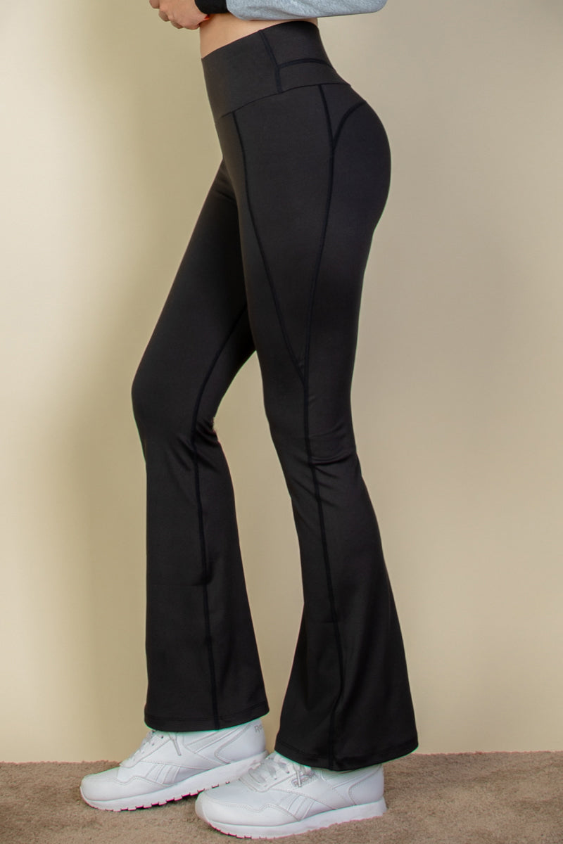 Flare leg pants with a wide waistband.