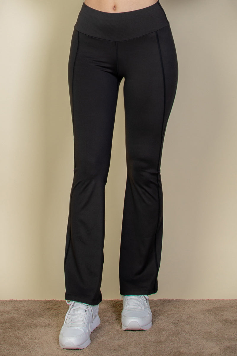 Flare leg pants with a wide waistband.