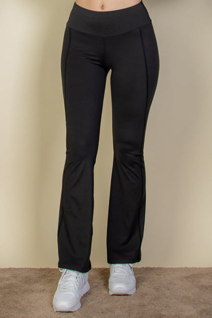 Flare leg pants with a wide waistband.