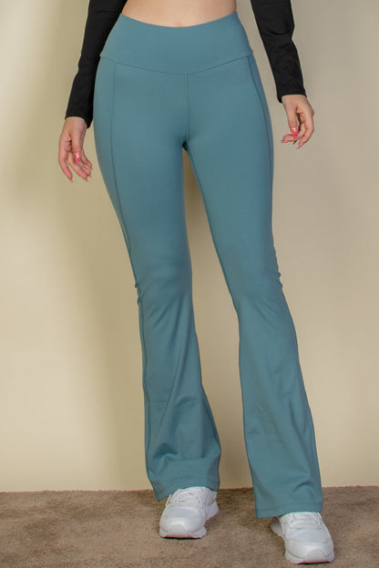 Flare leg pants with a wide waistband.