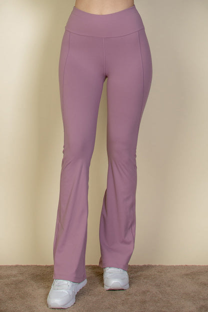 Flare leg pants with a wide waistband.