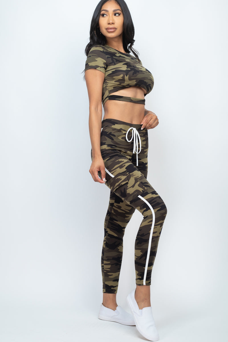 Cropped top and cargo pants set featuring a camo print with cut-out details