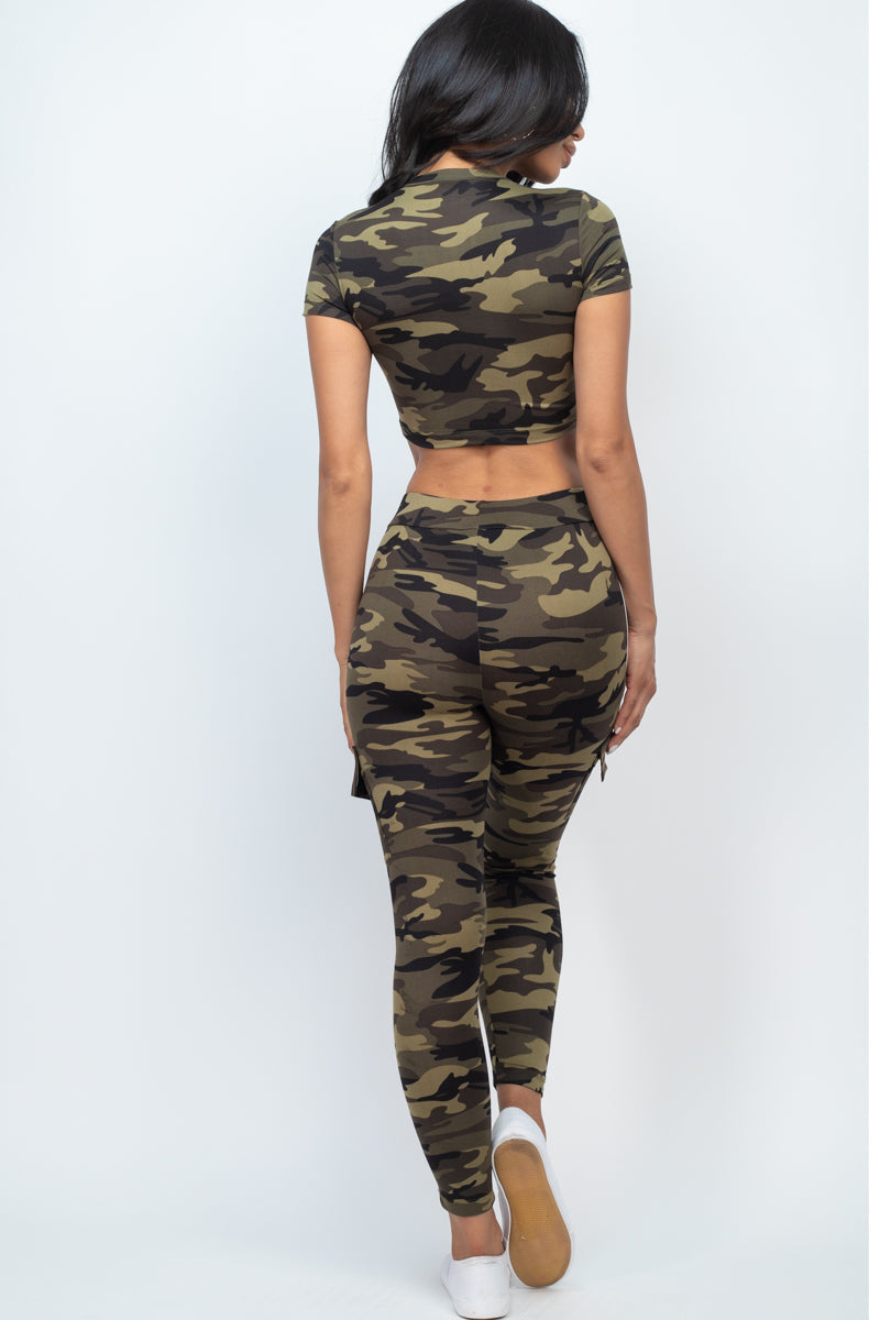 Cropped top and cargo pants set featuring a camo print with cut-out details